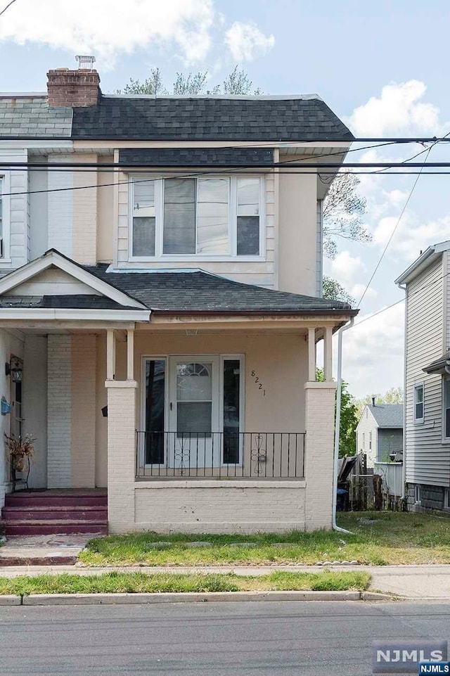 view of front of property featuring covered porch