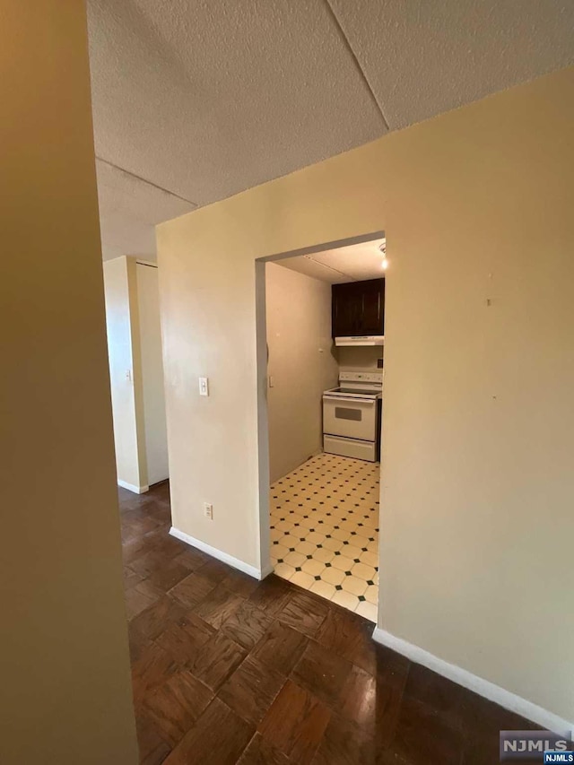 hallway featuring a textured ceiling