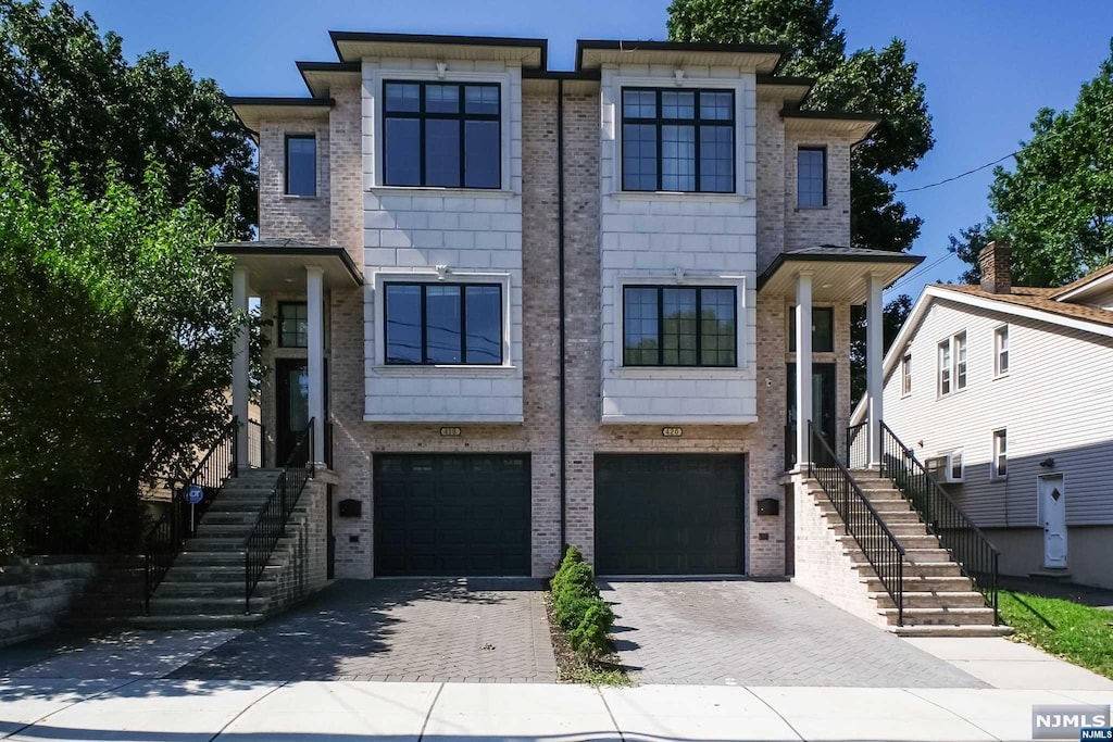 view of front of property with a garage