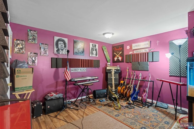 game room with hardwood / wood-style flooring