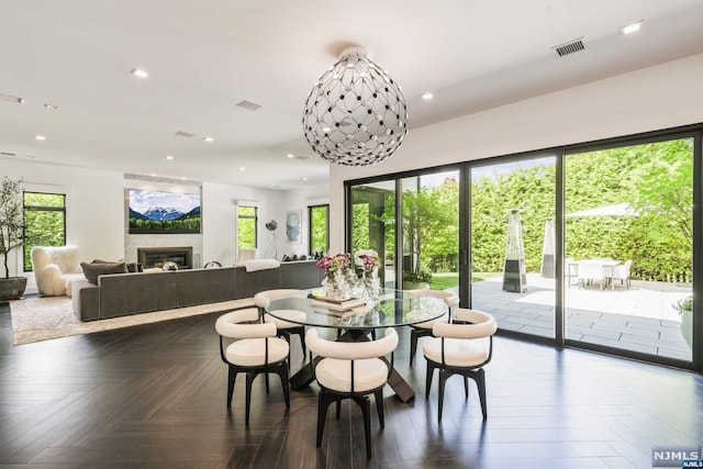 dining room featuring dark parquet floors