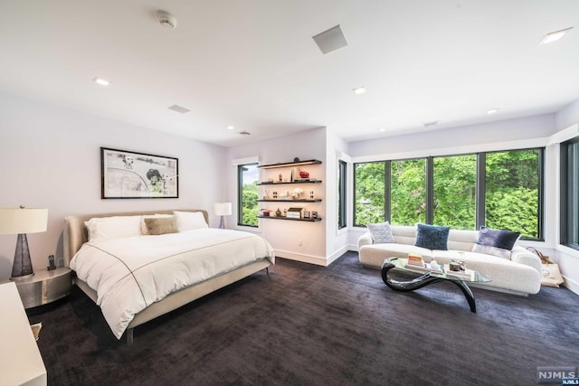 bedroom featuring dark colored carpet