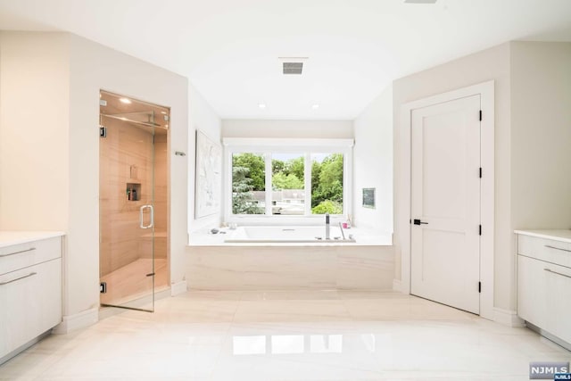 bathroom featuring tile patterned flooring, vanity, and independent shower and bath