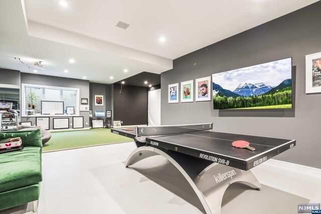 playroom with golf simulator