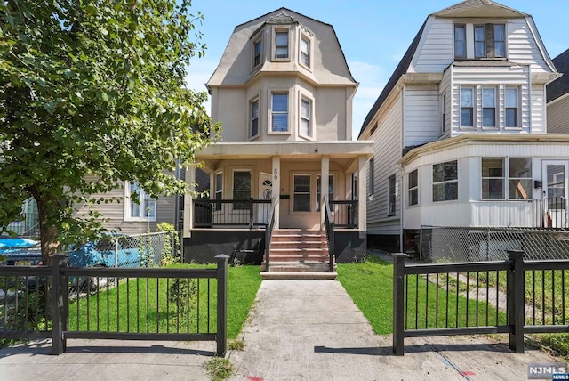 view of front of home with a front lawn and a porch