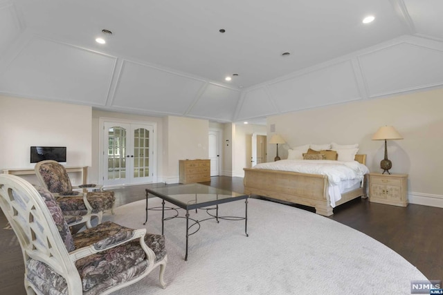 bedroom featuring lofted ceiling, dark hardwood / wood-style flooring, and french doors