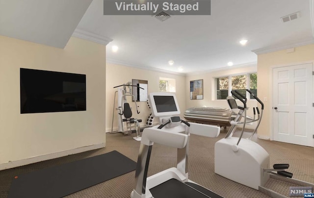 workout room with light carpet and crown molding