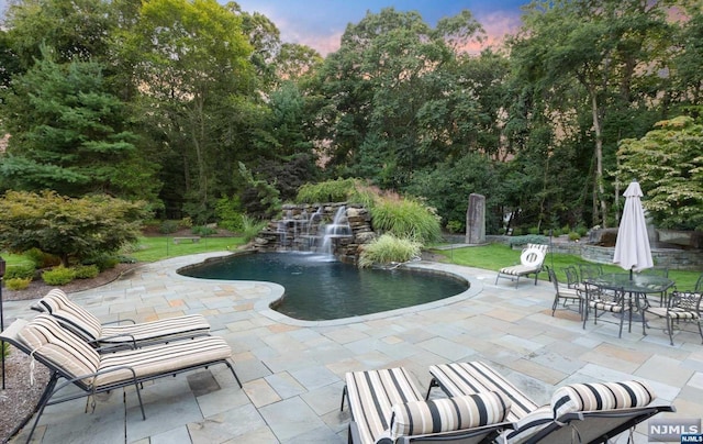 exterior space with a patio and a pool