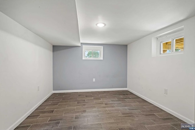 basement featuring dark wood-type flooring