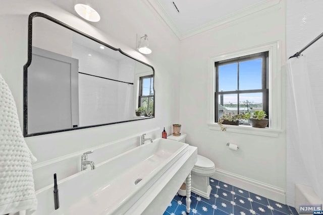 bathroom featuring toilet, shower / tub combo, and ornamental molding