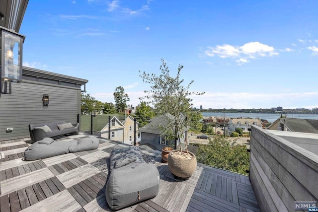 deck featuring a water view