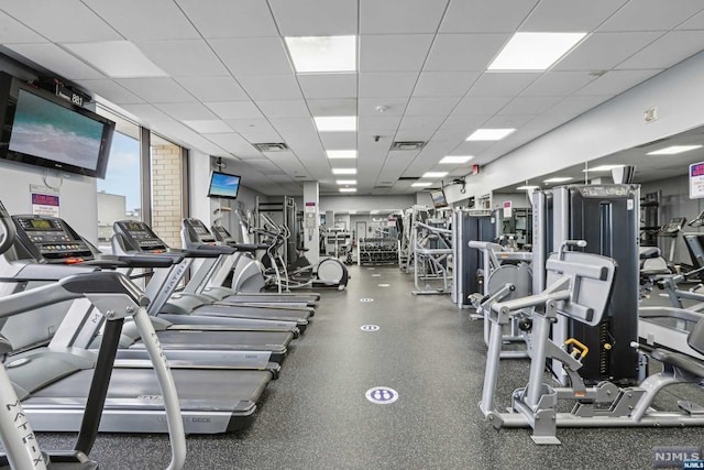 workout area with a drop ceiling