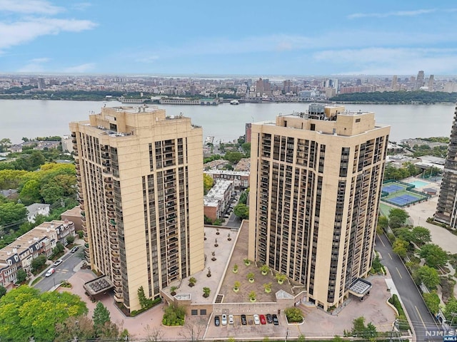 birds eye view of property with a water view