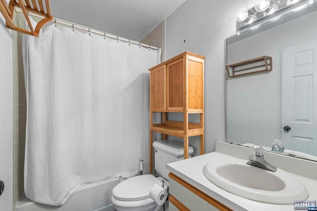 full bathroom with vanity, toilet, and shower / bath combo with shower curtain