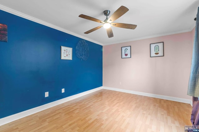 unfurnished room featuring ceiling fan, light hardwood / wood-style floors, and ornamental molding