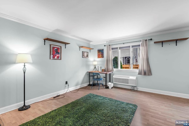 miscellaneous room featuring wood-type flooring, a wall unit AC, and ornamental molding