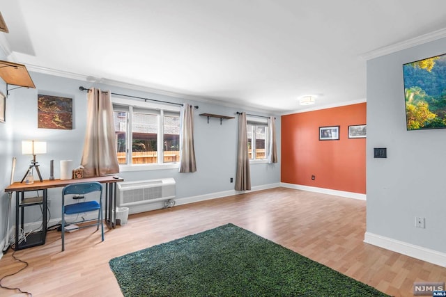 interior space with a healthy amount of sunlight, light wood-type flooring, and ornamental molding