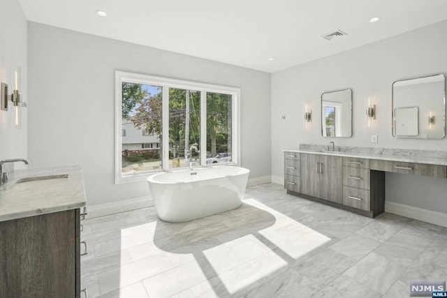 bathroom featuring a bathtub and vanity