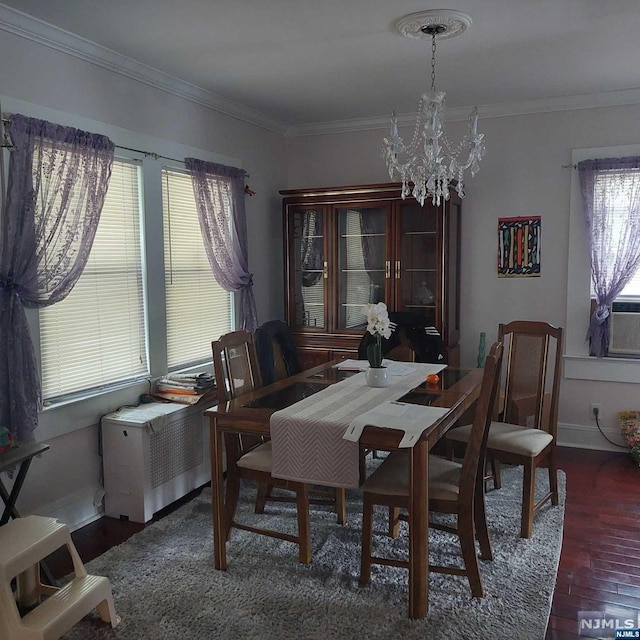 dining space featuring a healthy amount of sunlight, dark hardwood / wood-style flooring, and ornamental molding