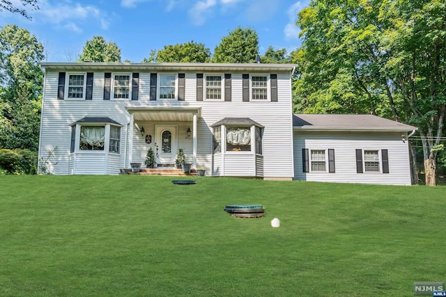 colonial home with a front yard