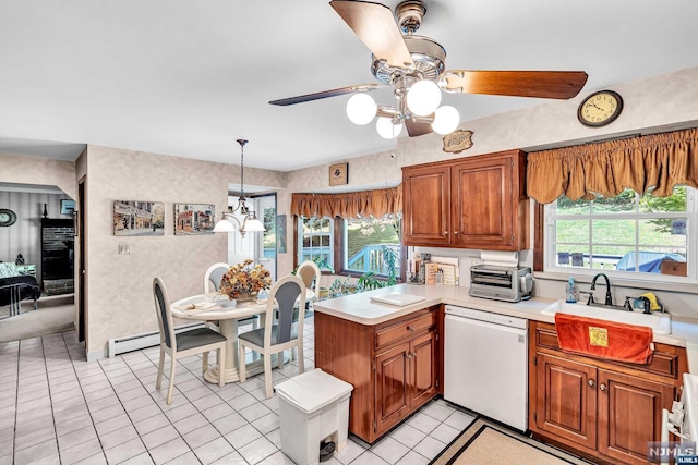 kitchen featuring kitchen peninsula, light tile patterned floors, white dishwasher, and sink