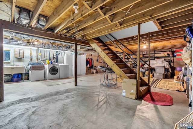 basement with washer and clothes dryer