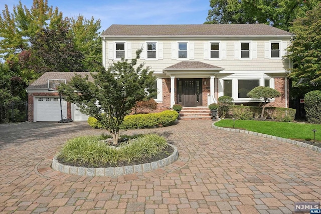 colonial home featuring a garage