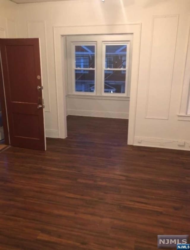 entrance foyer featuring dark hardwood / wood-style flooring