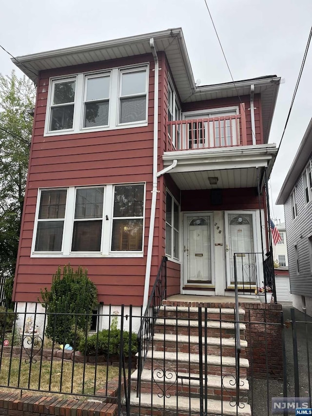 view of front of house with a balcony