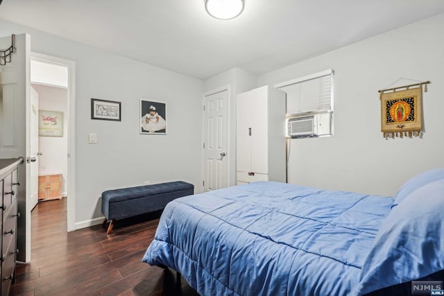 bedroom with dark hardwood / wood-style floors and cooling unit