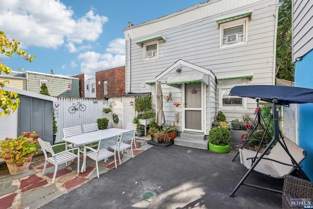 rear view of house with a patio