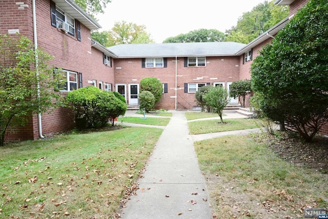 view of community featuring a lawn