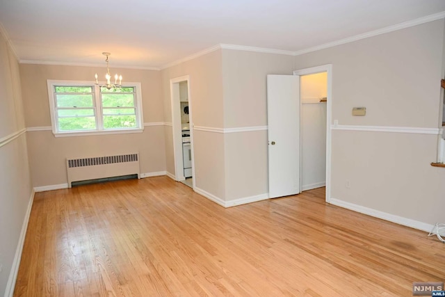 empty room with crown molding, radiator heating unit, light hardwood / wood-style floors, and a notable chandelier