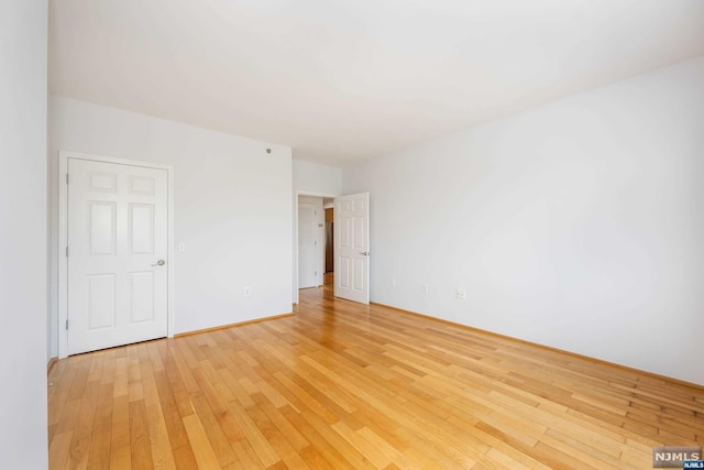 unfurnished room featuring light hardwood / wood-style flooring