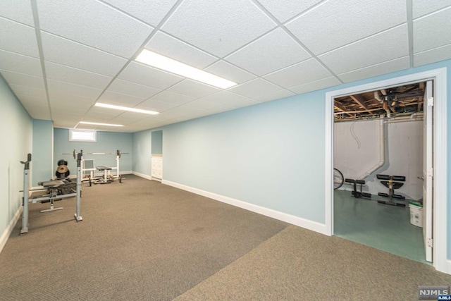 workout room featuring a drop ceiling and carpet floors