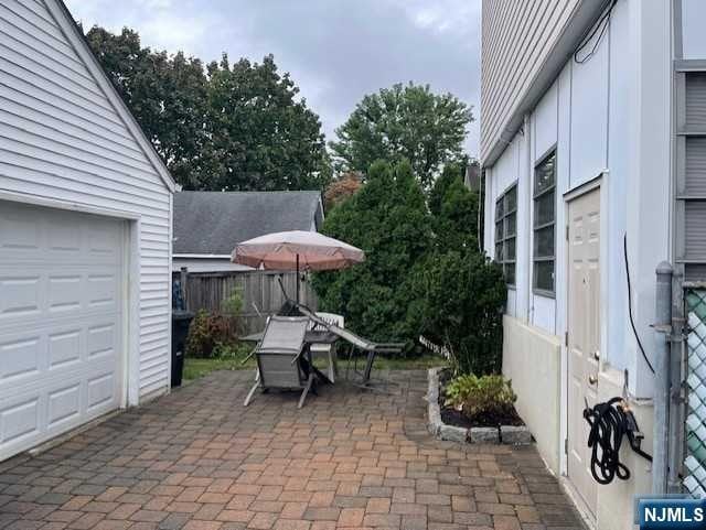 view of patio / terrace featuring a garage