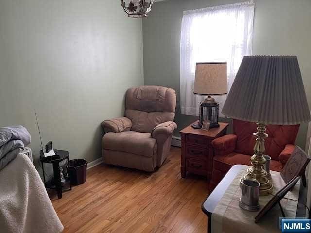 sitting room with light hardwood / wood-style flooring