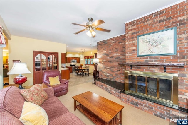 living room featuring a fireplace, a ceiling fan, and light colored carpet