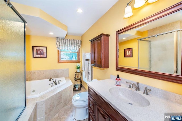 bathroom featuring a stall shower, toilet, a tub with jets, tile patterned flooring, and vanity