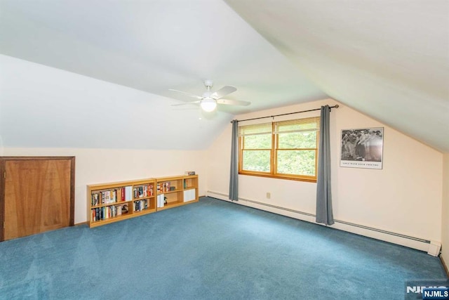 additional living space with a baseboard radiator, carpet flooring, vaulted ceiling, and ceiling fan