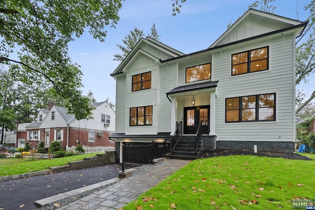 view of front facade featuring a front yard and a garage