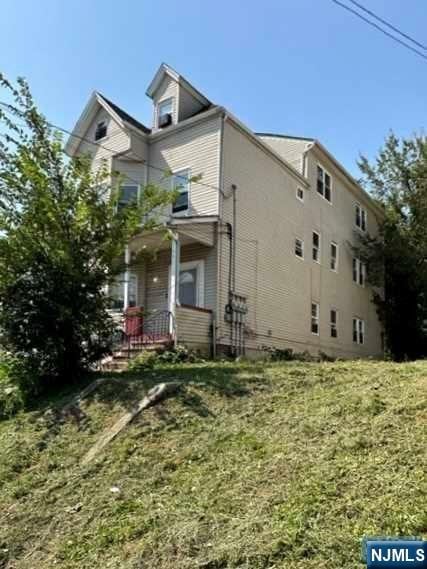 view of home's exterior with a yard