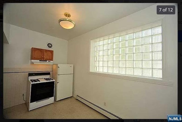 kitchen featuring white appliances, exhaust hood, and a baseboard radiator