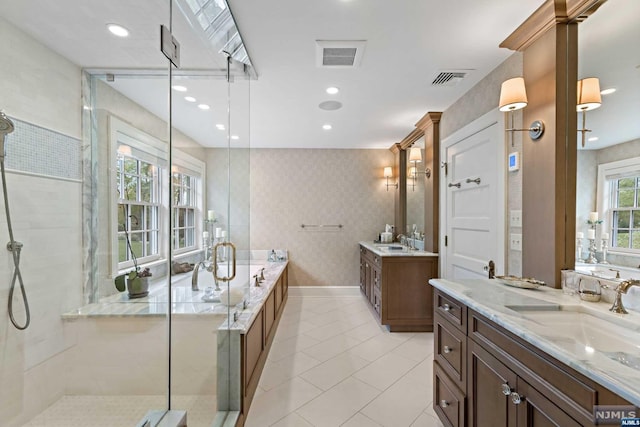 bathroom with separate shower and tub, tile patterned floors, and vanity