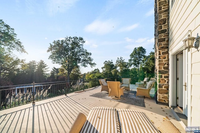 wooden deck featuring outdoor lounge area