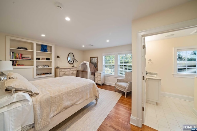 bedroom with light hardwood / wood-style flooring