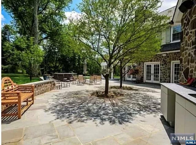 view of patio featuring french doors