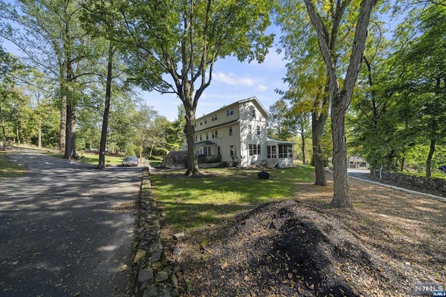 view of front of property with a sunroom