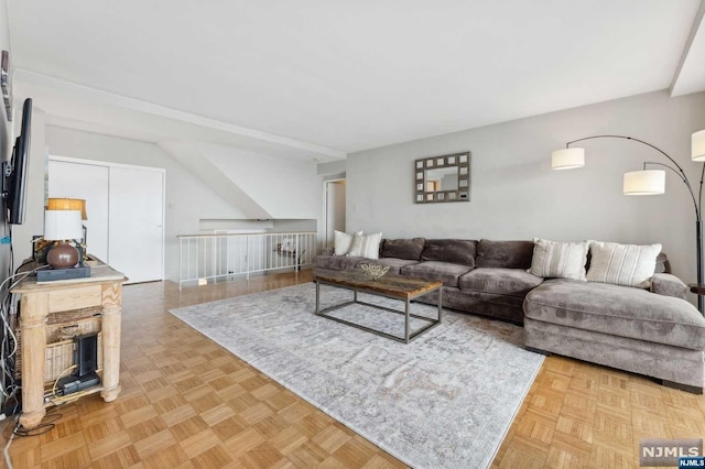 living room featuring parquet flooring