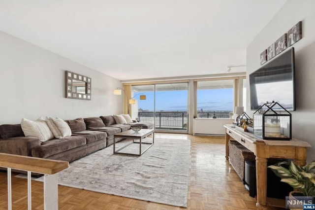 living room featuring light parquet flooring